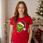 Sly smirking face holiday lights Christmas Unisex T-Shirt